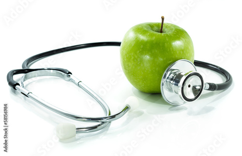 Fotografia protect your health with healthy nutrition.Stethoscope, apple