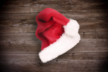 Wall Mural - Santa cap on wooden background