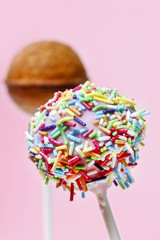 Poster - Steps of making cake pops decorated with sprinkles on pink back