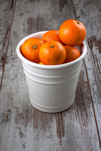 Mandarins In White Metal Bucket