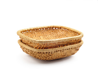 Two little wicker baskets isolated on white background