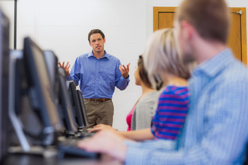 Poster - Teacher explaining to students in computer room