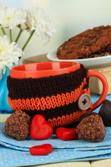 Aufkleber - Cup with knitted thing on it close up