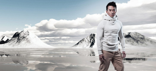 Wall Mural - Asian winter fashion man in snow mountain landscape. Wearing whi