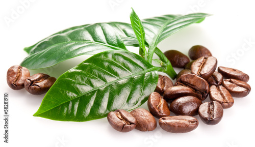 Fototapeta na wymiar Roasted coffee beans and leaves.