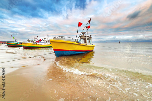 Fototapeta na wymiar Fishing boats on the beach of Baltic Sea in Poland