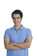 © imagedb.com - Man standing with his arms crossed and smiling