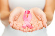© Syda Productions - hands holding pink breast cancer awareness ribbon
