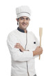 © imagedb.com - Portrait of a male chef holding a spatula and smiling