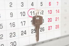A House Key On A Calendar Background,