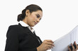 © imagedb.com - Businesswoman reading a document