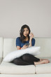 © imagedb.com - Woman holding a cricket ball and operating a remote control