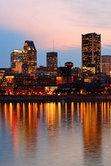 Wall Mural - Montreal over river at sunset