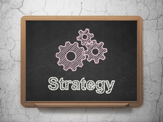 Business concept: Gears and Strategy on chalkboard background