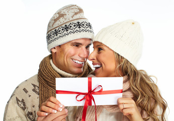 Wall Mural - Happy couple with christmas present.