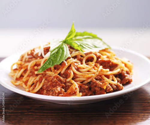 Obraz w ramie spaghetti dinner with meat sauce and basil