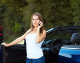 Fototapeta  - Caucasian girl on a cell phone service or tow truck traffic near