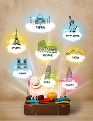 Wall Mural - Tourist suitcase with famous landmarks around the world