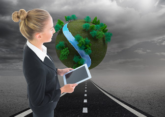 Aufkleber - Composite image of businesswoman holding tablet