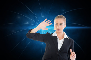 Wall Mural - Composite image of businesswoman pointing somewhere