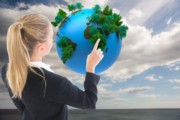 Aufkleber - Composite image of businesswoman pointing somewhere