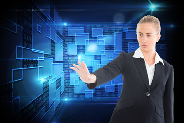 Poster - Composite image of businesswoman pointing somewhere