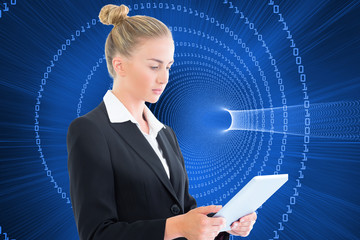 Wall Mural - Composite image of businesswoman holding tablet