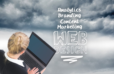 Aufkleber - Composite image of businesswoman using laptop