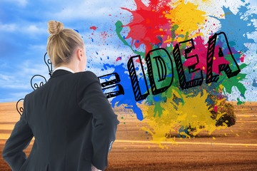 Poster - Composite image of businesswoman standing with hands on hips