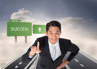 Poster - Composite image of smiling asian businessman pointing