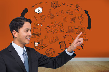 Poster - Composite image of smiling asian businessman pointing