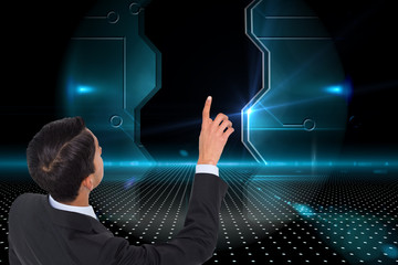 Poster - Composite image of asian businessman pointing