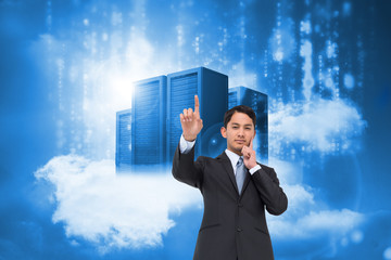 Poster - Composite image of thoughtful asian businessman pointing