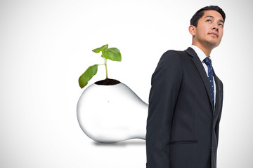 Poster - Composite image of serious asian businessman