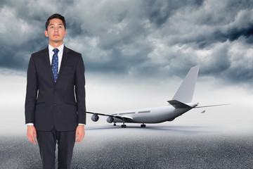 Poster - Composite image of serious businessman looking up