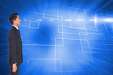 Poster - Composite image of unsmiling businessman looking away