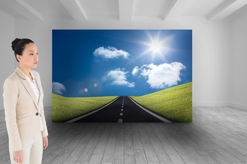 Poster - Composite image of unsmiling asian businesswoman
