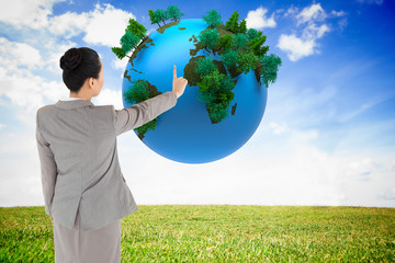 Aufkleber - Composite image of asian businesswoman pointing