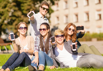 Wall Mural - students showing smartphones