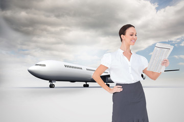 Poster - Composite image of cheerful stylish businesswoman holding newspa