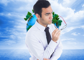 Aufkleber - Composite image of unsmiling businessman holding glasses