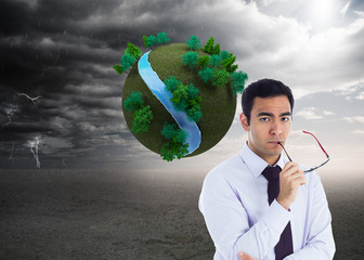 Poster - Composite image of unsmiling businessman holding glasses
