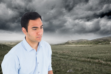 Poster - Composite image of unsmiling casual man standing