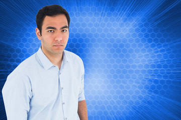 Poster - Composite image of unsmiling casual man standing