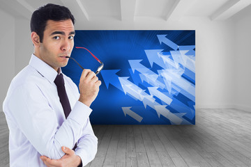 Poster - Composite image of unsmiling businessman holding glasses