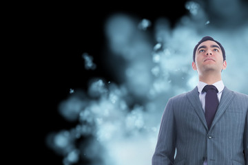 Poster - Composite image of unsmiling businessman standing