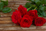 Fototapeta Kwiaty - bouquet of beautiful  red roses with water drops