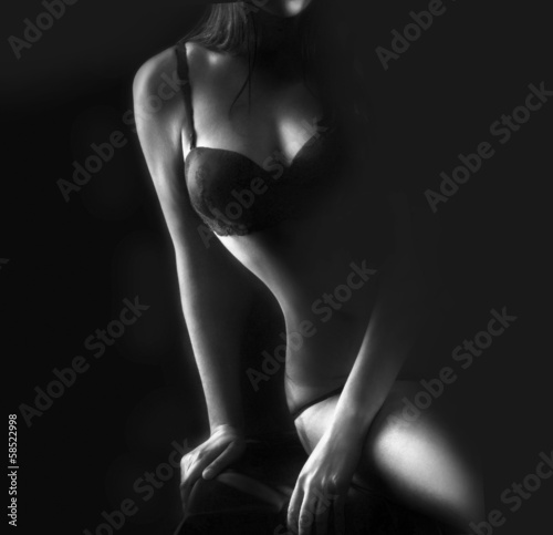 Fototapeta na wymiar Perfect woman body on black background