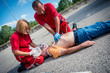 Paramedics succor a man with heart attack