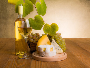 Wall Mural - White wine with grape and cheese snack